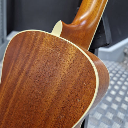 Pre-Owned Cordoba 15CM Close-up of a wooden guitar neck with a blurred background
