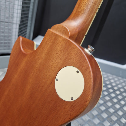 Pre-Owned Epiphone Les Paul Close-up of a wooden guitar neck with a gold pickguard.