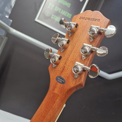 Pre-Owned Epiphone Les Paul Guitar headstock with tuning pegs on a blurred background