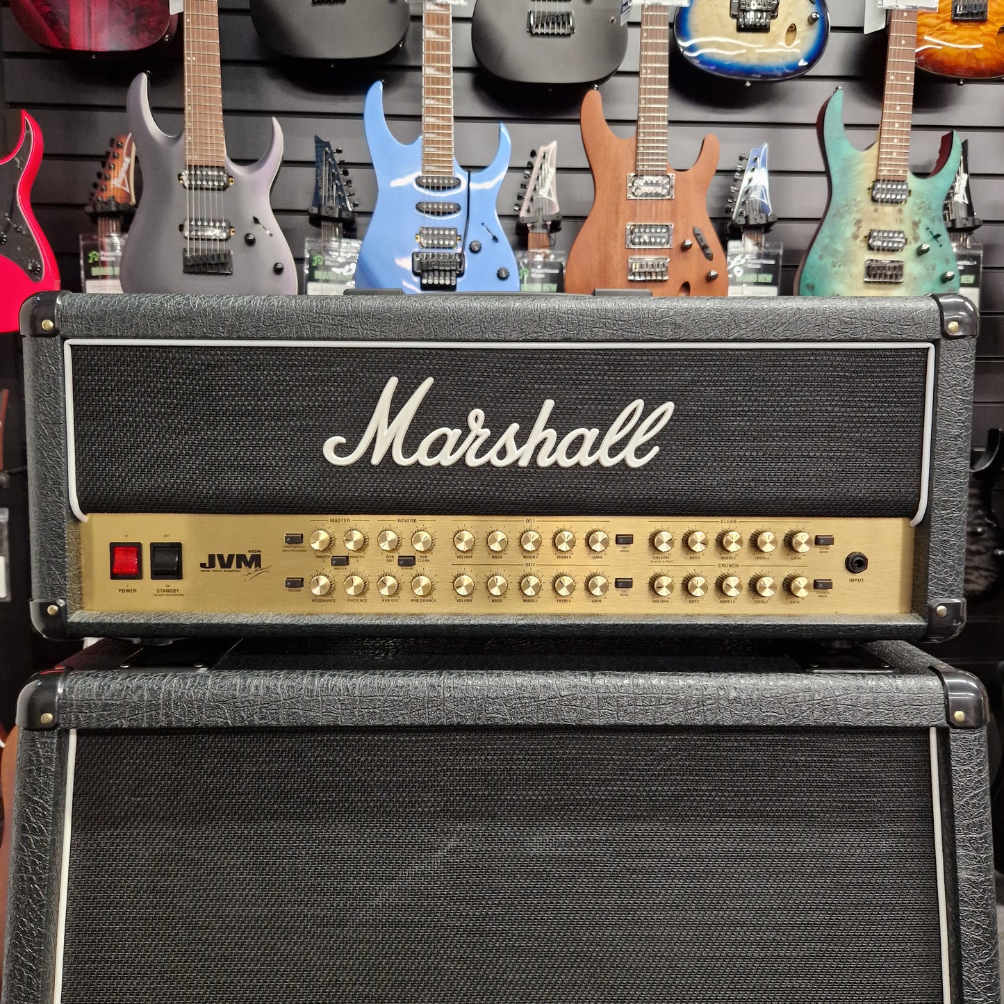 Pre-Owned Marshall JVM410H Marshall guitar amplifier with guitars in the background