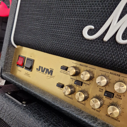 Pre-Owned Marshall JVM410H Control panel of a guitar amplifier with gold knobs and 'JVM' branding.