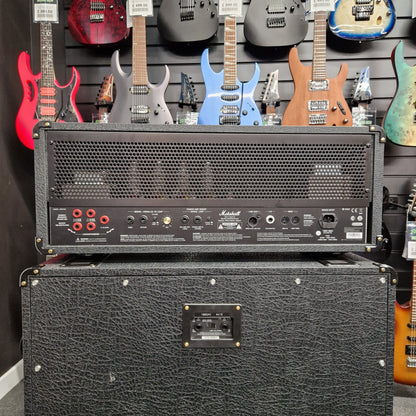 Pre-Owned Marshall JVM410H Two guitar amplifiers with a background of colorful guitars