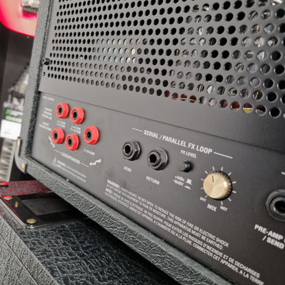 Pre-Owned Marshall JVM410H Close-up of an audio equipment panel with knobs and connectors.