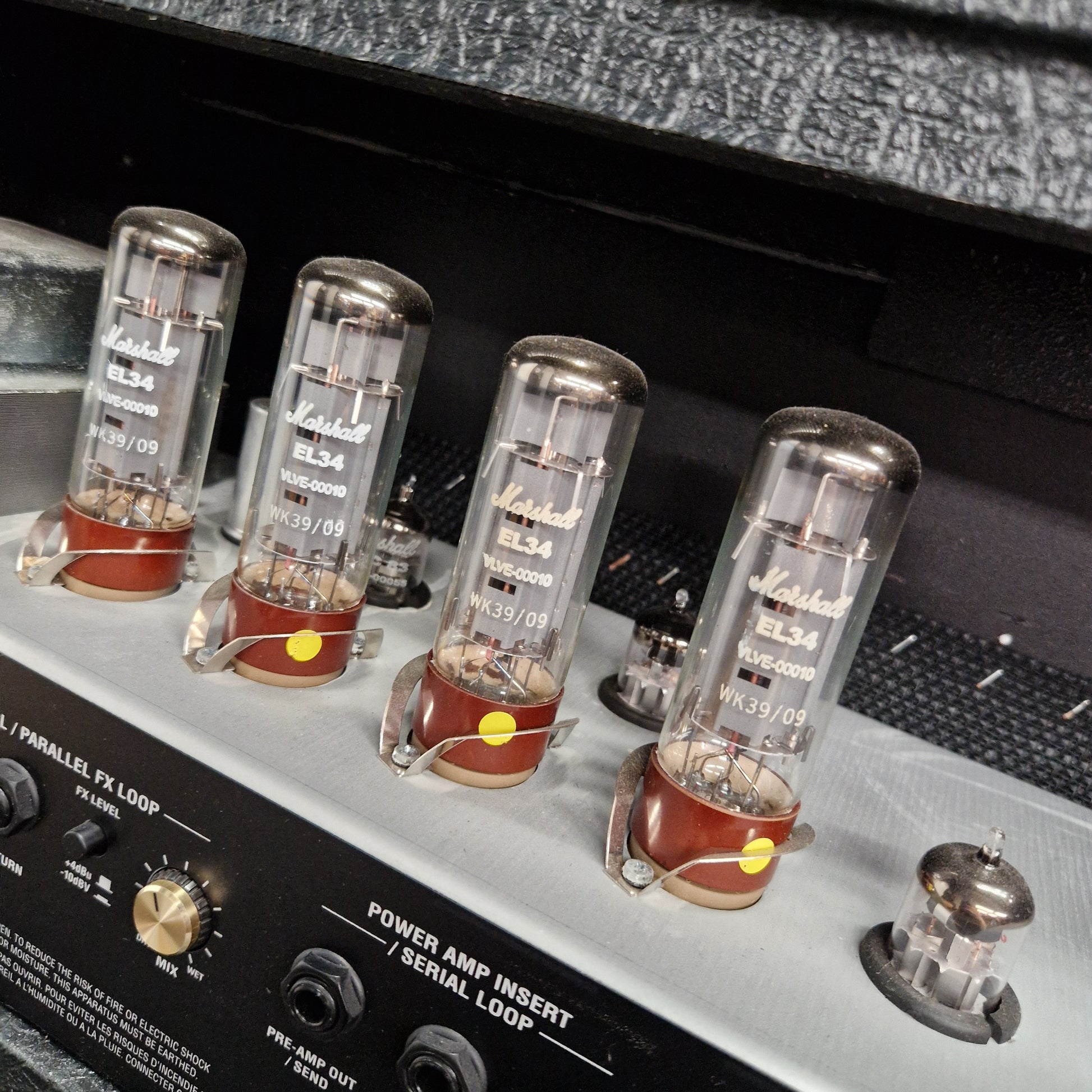 Pre-Owned Marshall JVM410H Vacuum tubes on a vintage amplifier with visible brand labels.