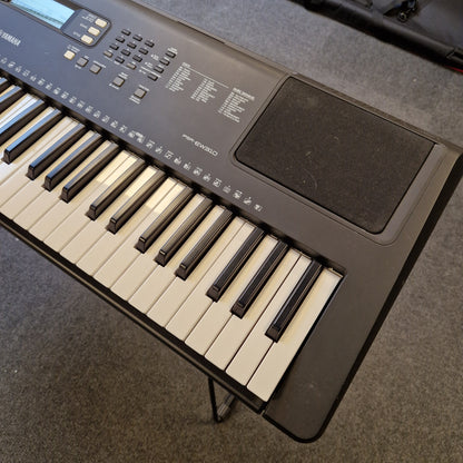 Pre-Owned Yamaha PSR-EW310 Keyboard on a gray surface