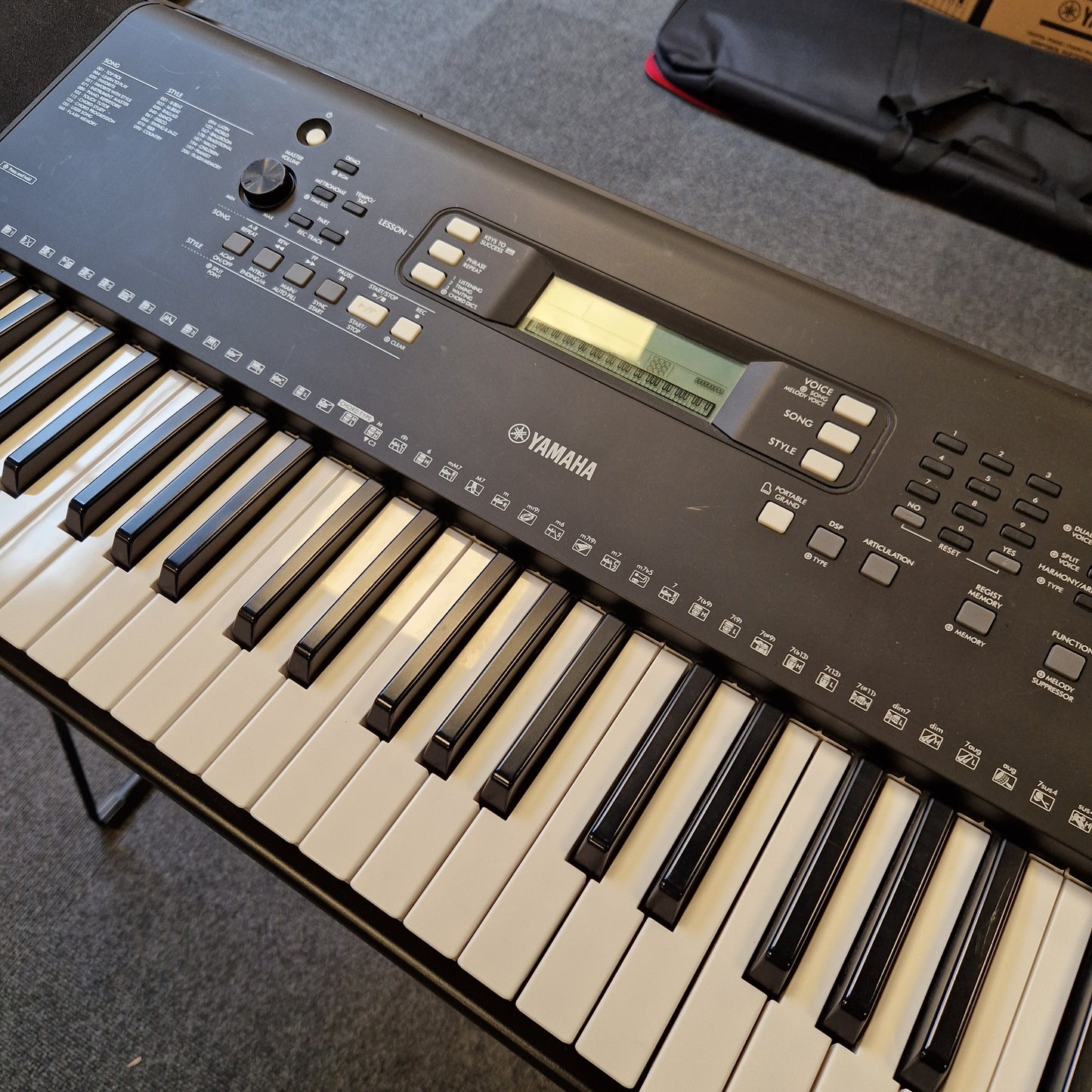 Pre-Owned Yamaha PSR-EW310 Yamaha keyboard on a gray surface