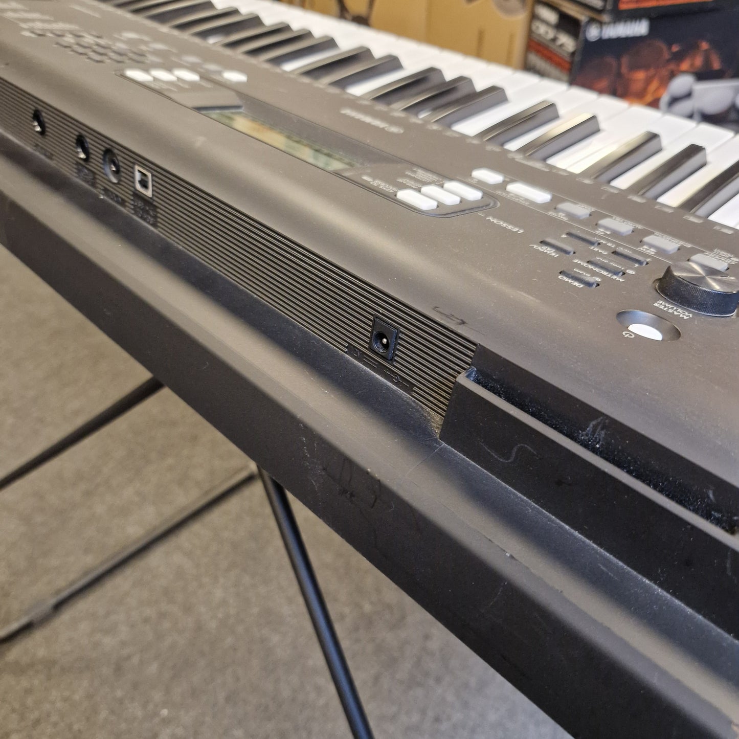 Pre-Owned Yamaha PSR-EW310 Close-up of a electronic keyboard with visible keys and control panel.