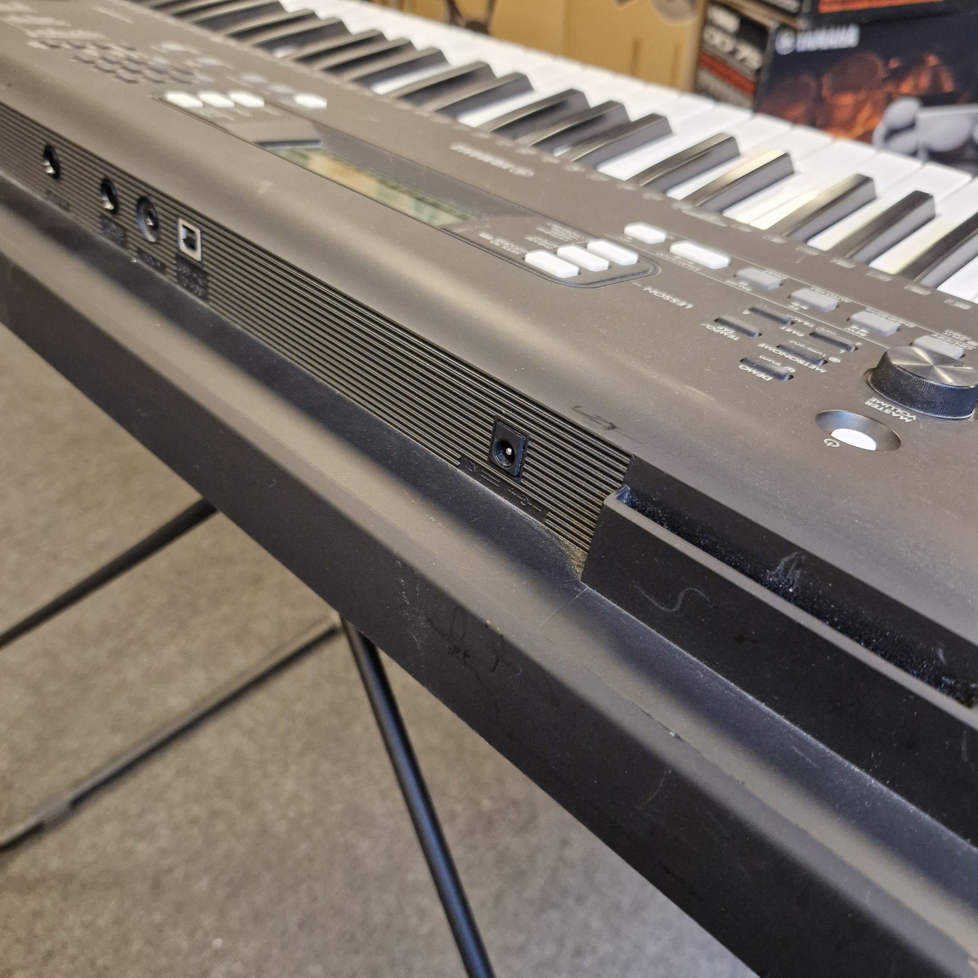 Pre-Owned Yamaha PSR-EW310 Close-up of a electronic keyboard with visible keys and control panel.