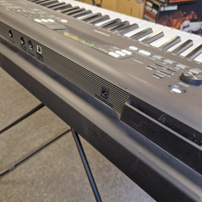 Pre-Owned Yamaha PSR-EW310 Close-up of a electronic keyboard with visible keys and control panel.