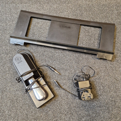 Pre-Owned Yamaha PSR-EW310 Metal door handle assembly on a textured surface