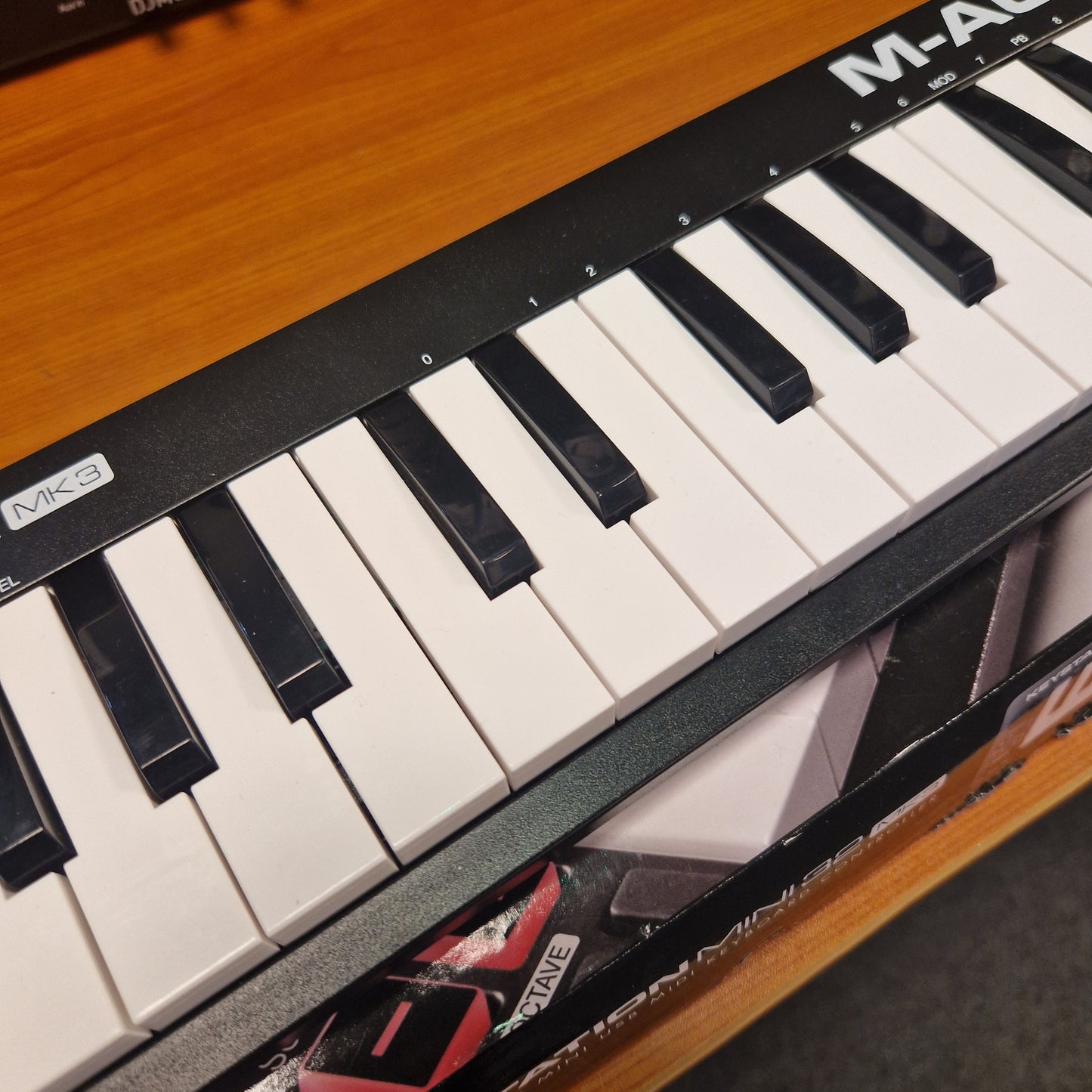 Pre-Owned M-Audio Keystation Mini 32 Close-up of a keyboard with visible brand name on keys