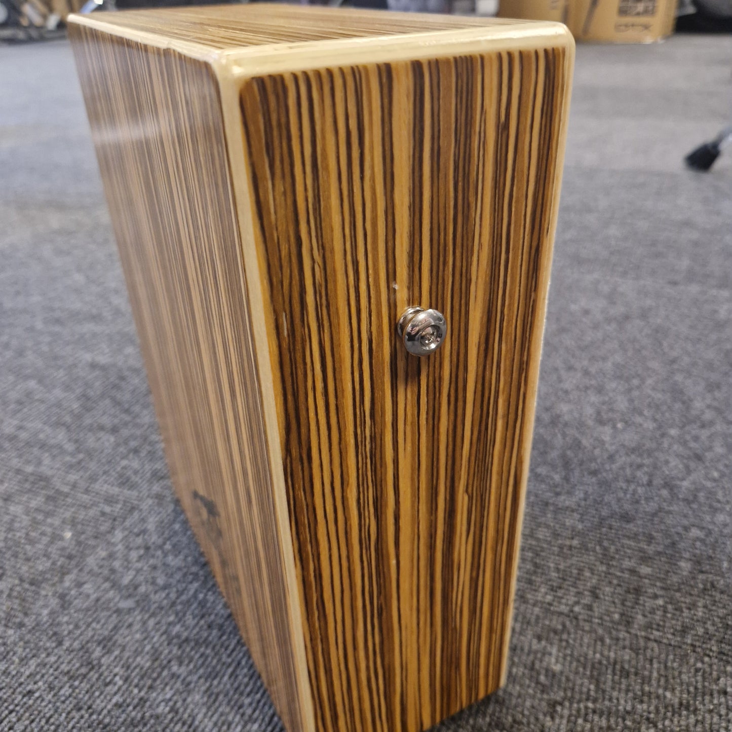 Pre-Owned Gecko C-68Z Wooden block with a metallic knob on a textured surface