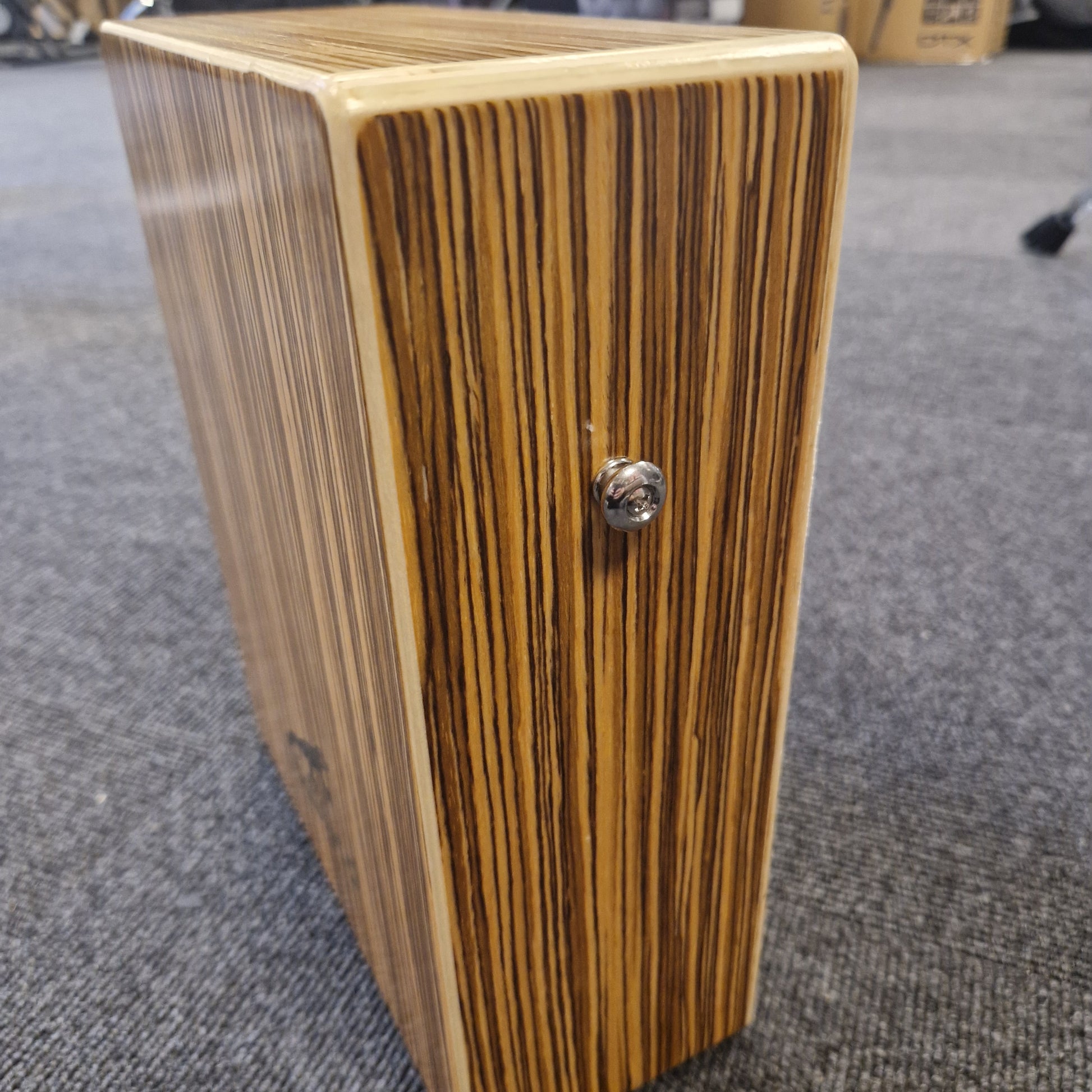 Pre-Owned Gecko C-68Z Wooden block with a metallic knob on a textured surface