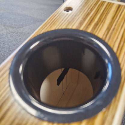 Pre-Owned Gecko C-68Z Close-up of a black circular object on a wooden surface