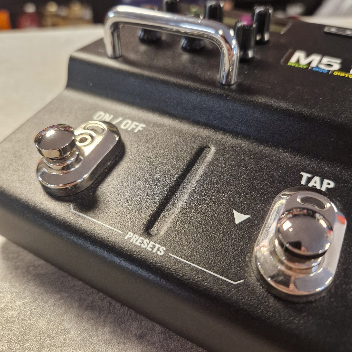 Pre-Owned Line 6 M5 Close-up of a control panel with buttons and labels on a device.