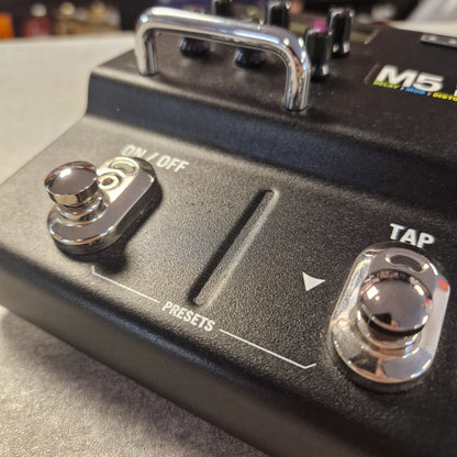 Pre-Owned Line 6 M5 Close-up of a control panel with buttons and labels on a device.