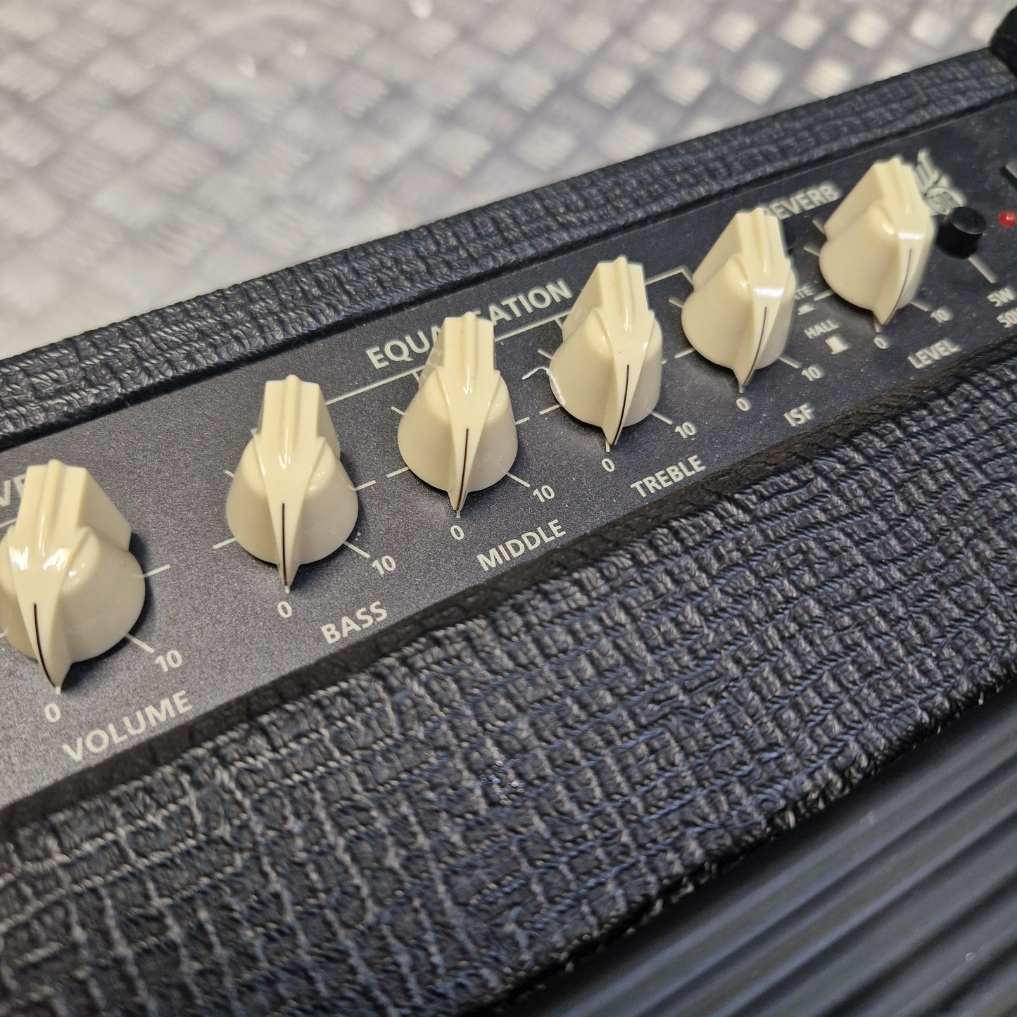 Pre-Owned Blackstar Debut 50R Close-up of an amplifier with control knobs on a textured surface