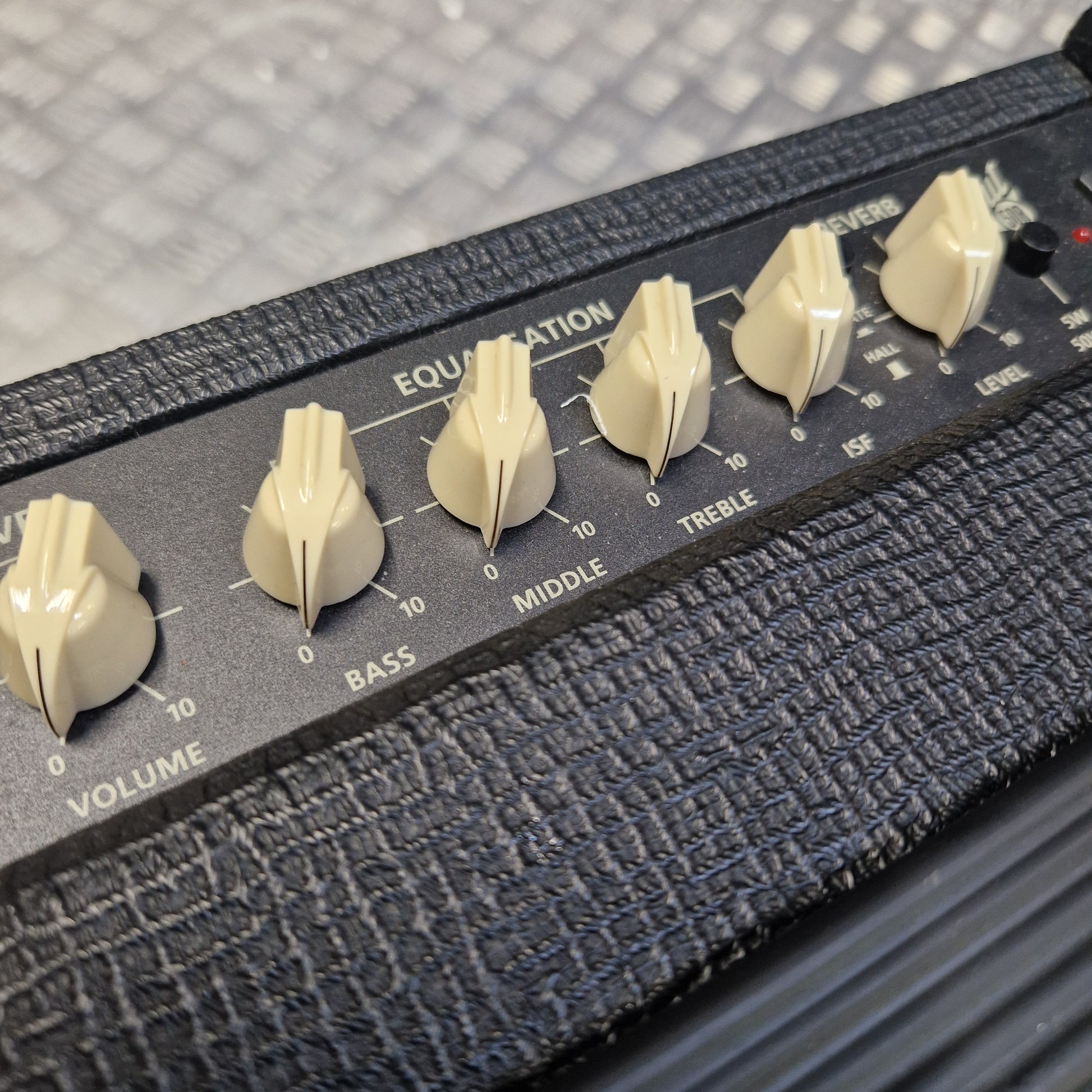 Pre-Owned Blackstar Debut 50R Close-up of an amplifier with control knobs on a textured surface