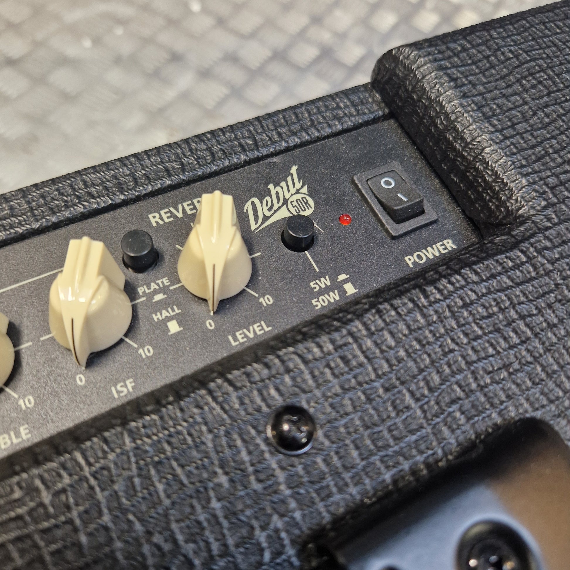 Pre-Owned Blackstar Debut 50R Close-up of a guitar amplifier with control knobs and brand name 'Delux'.