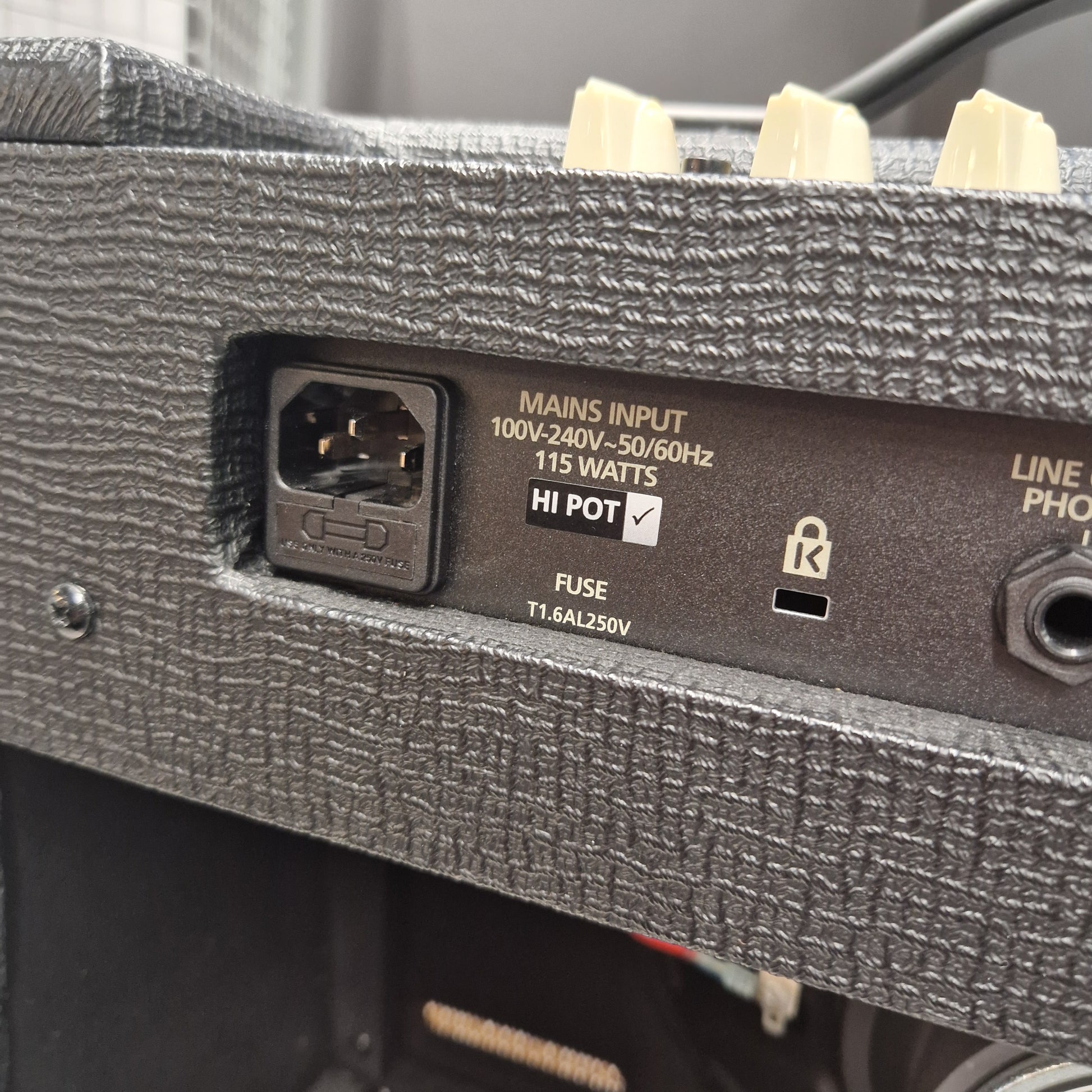 Pre-Owned Blackstar Debut 50R Close-up of a power input socket on an electronic device with text and symbols.