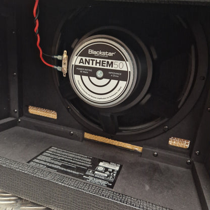 Pre-Owned Blackstar Debut 50R Close-up of a Blackstar Anthem 60 speaker in a guitar amplifier cabinet.