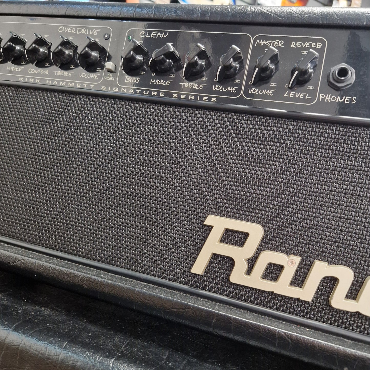 Pre-Owned Randall KH-120 Close-up of a Roland guitar amplifier with control knobs and brand name.
