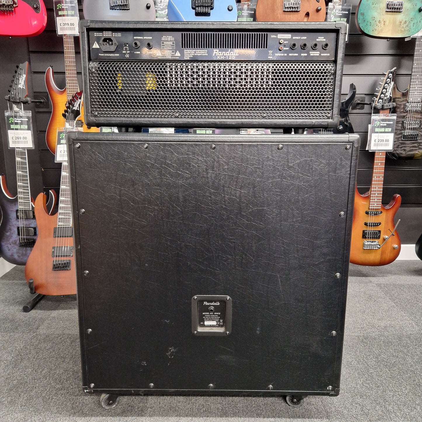 Pre-Owned Randall KH-120 Black speaker cabinet with visible branding in a music store setting