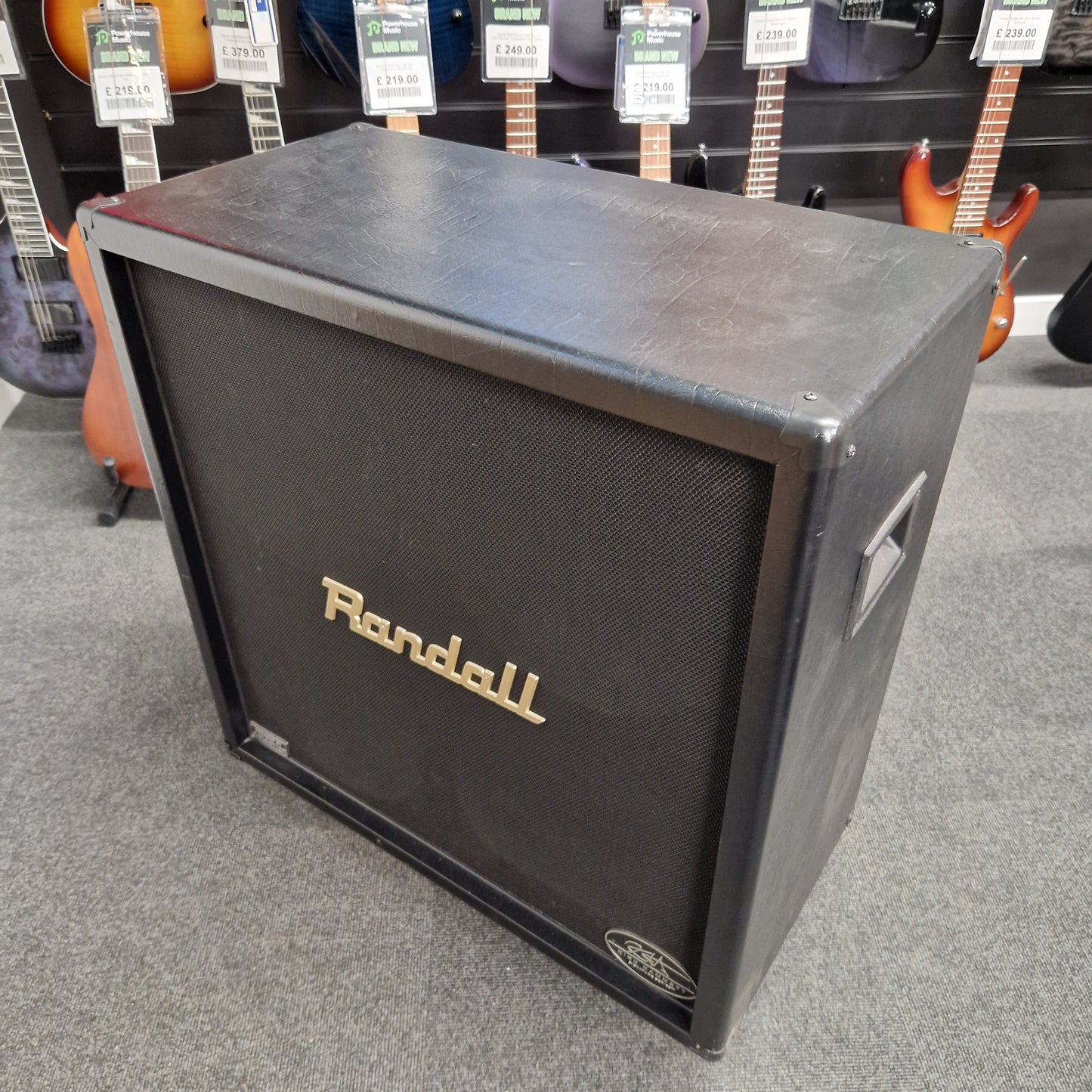 Pre-Owned Randall KH-120 Randall guitar amplifier on display with guitars in the background