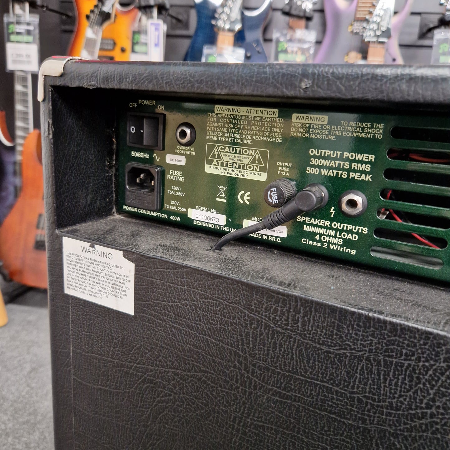 Pre-Owned Ashdown MAG-C210T-300EVO Back of a guitar amplifier with control panel and wiring, blurred background