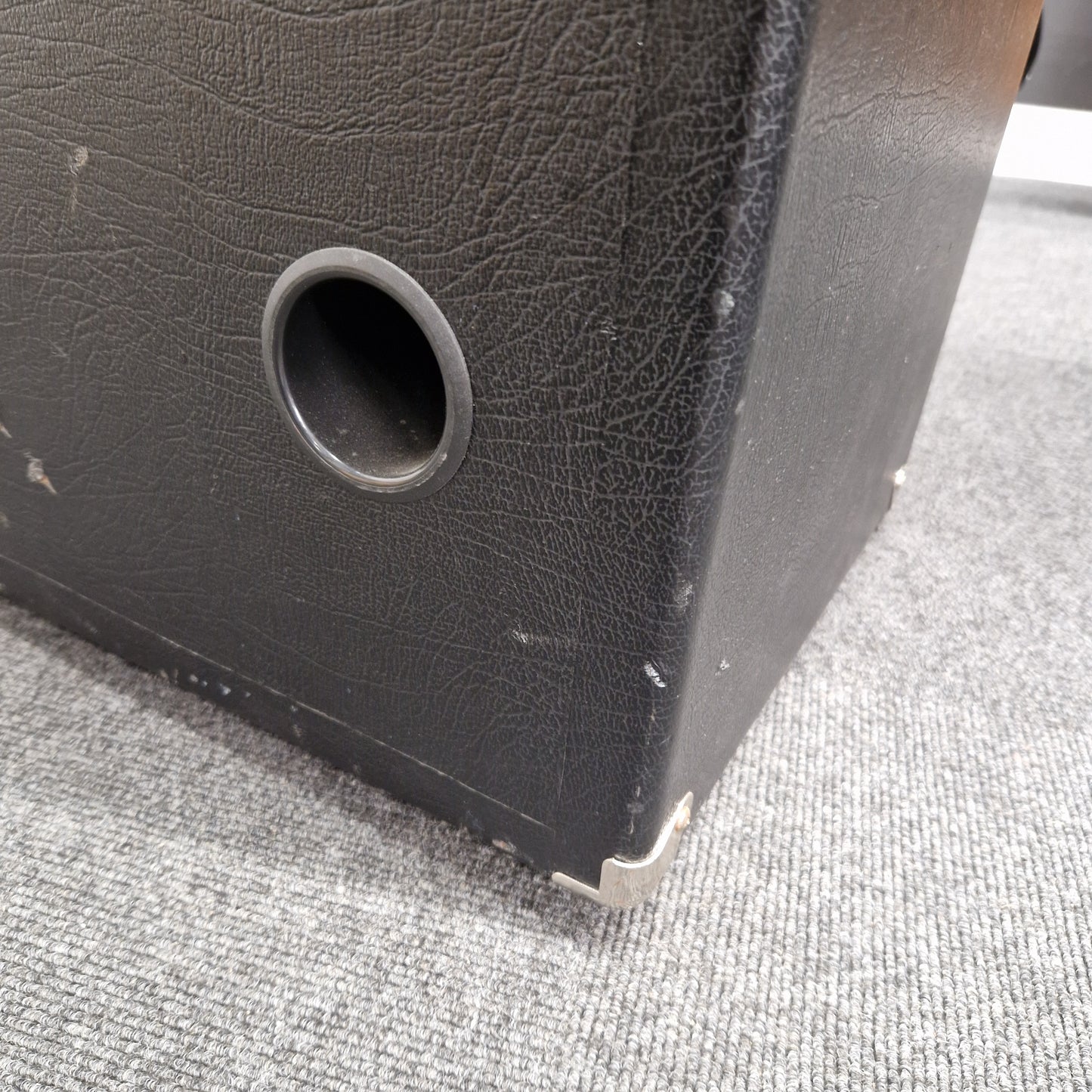 Pre-Owned Ashdown MAG-C210T-300EVO Black speaker on a textured gray surface
