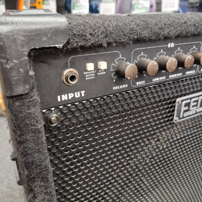 Pre-Owned Fender Rumble 100 Close-up of a Fender guitar amplifier with control knobs and input jack.