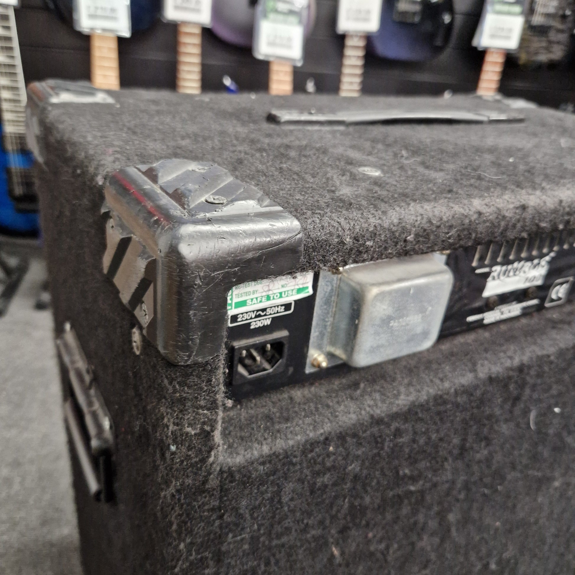 Pre-Owned Fender Rumble 100 Close-up of a guitar amplifier with visible components