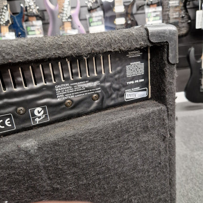 Pre-Owned Fender Rumble 100 Guitar amplifier with control panel and branding in a music store setting