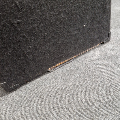 Pre-Owned Fender Rumble 100 Black mat on a gray carpeted floor