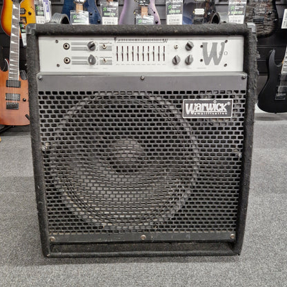 Pre-Owned Warwick BC300 Wampler pedal board with visible branding on a gray surface