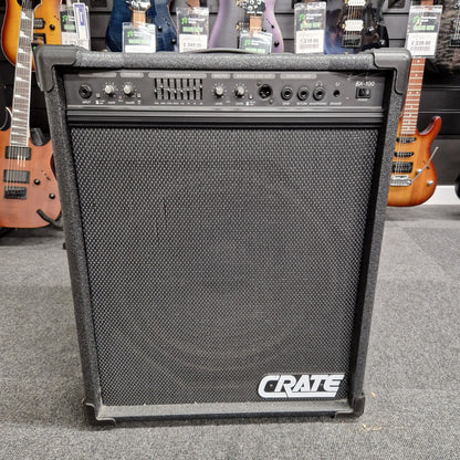 Pre-Owned Crate BX-100 Guitar amplifier with 'Crane' branding in a music store setting