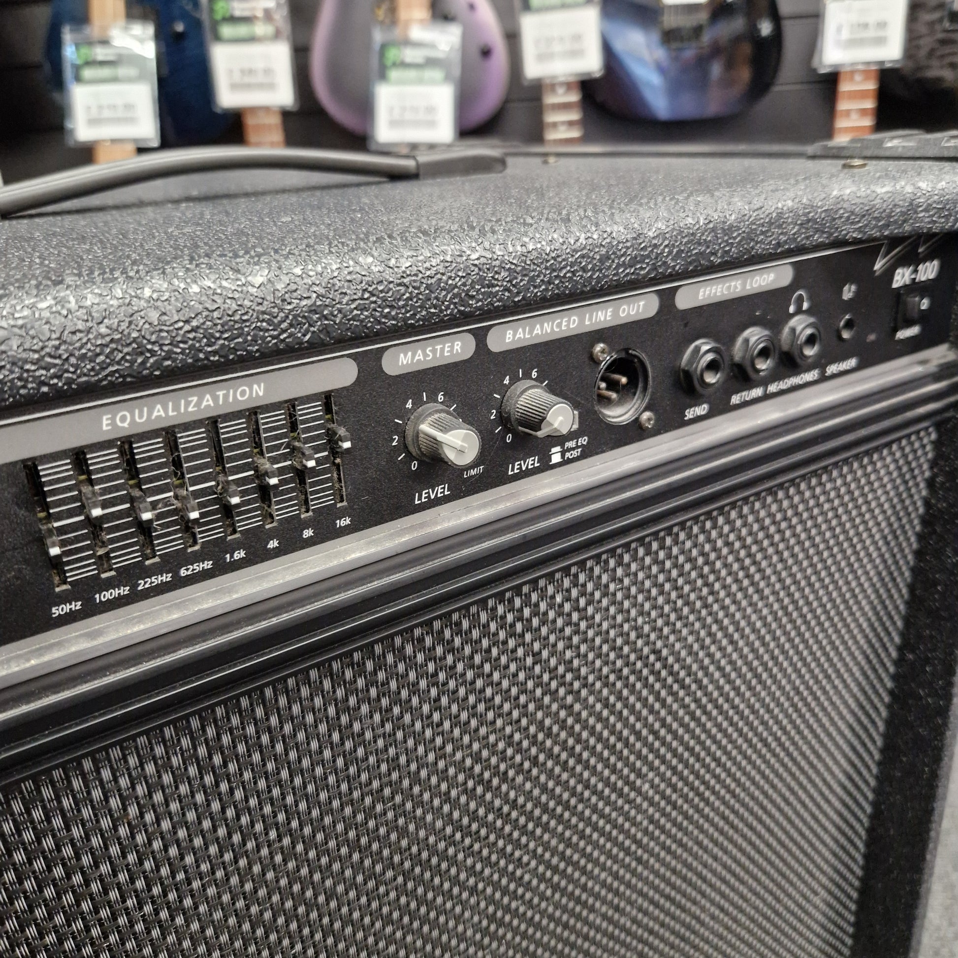 Pre-Owned Crate BX-100 Close-up of a guitar amplifier with control panel and speaker grille.