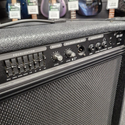 Pre-Owned Crate BX-100 Close-up of a guitar amplifier with control panel and speaker grille.