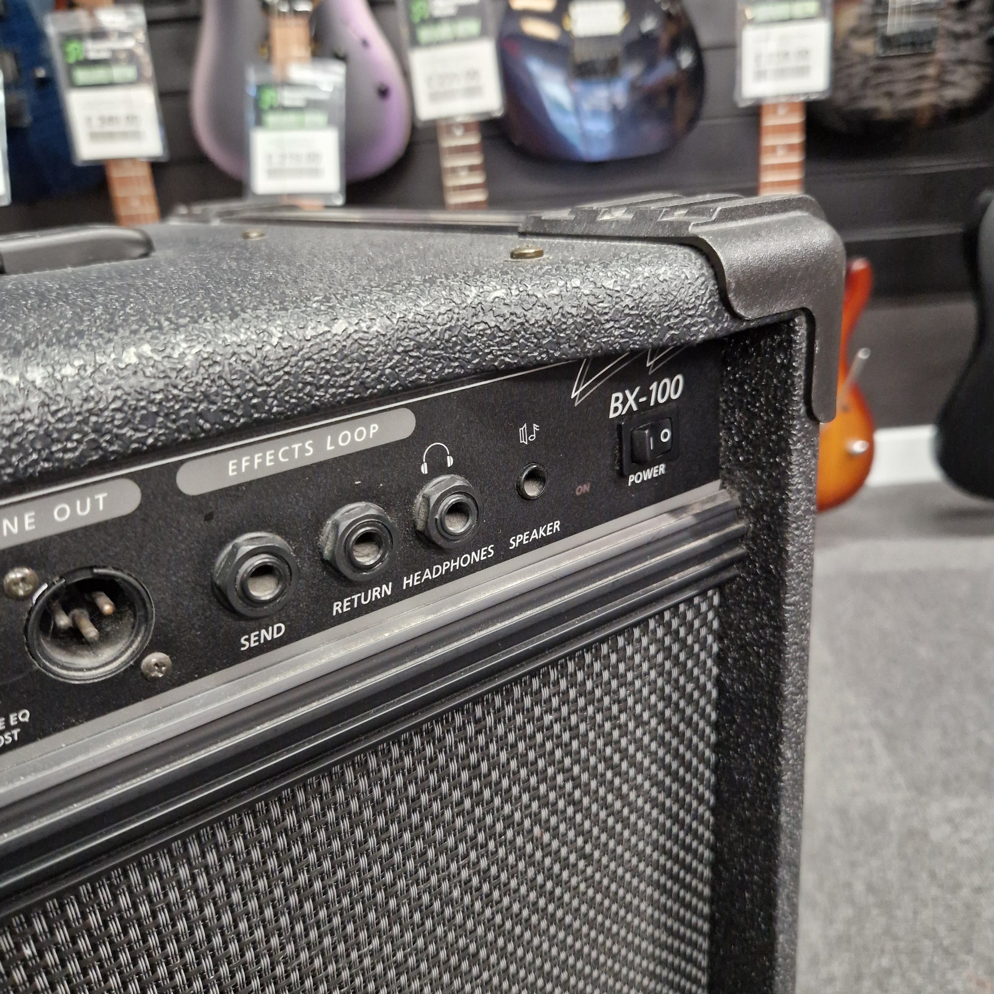 Pre-Owned Crate BX-100 Guitar amplifier with control panel in a music store setting