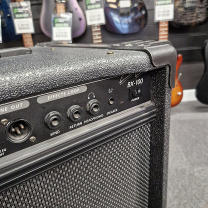 Pre-Owned Crate BX-100 Guitar amplifier with control panel in a music store setting