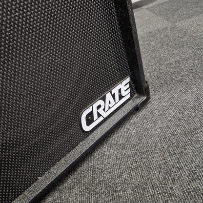 Pre-Owned Crate BX-100 Close-up of a Crate guitar amplifier on a textured surface