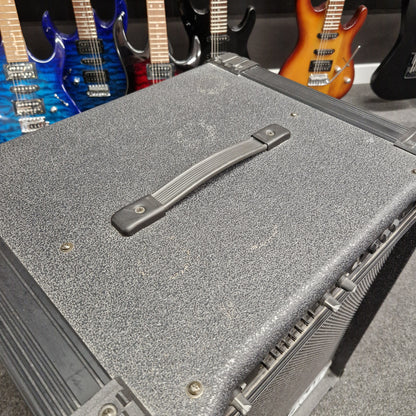 Pre-Owned Crate BX-100 Close-up of a guitar case with guitars partially visible inside