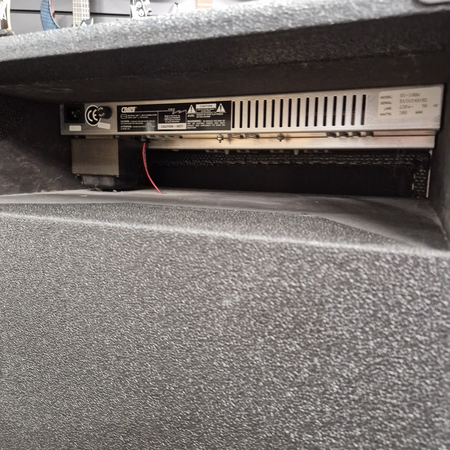 Pre-Owned Crate BX-100 Close-up of a car audio system inside a vehicle.