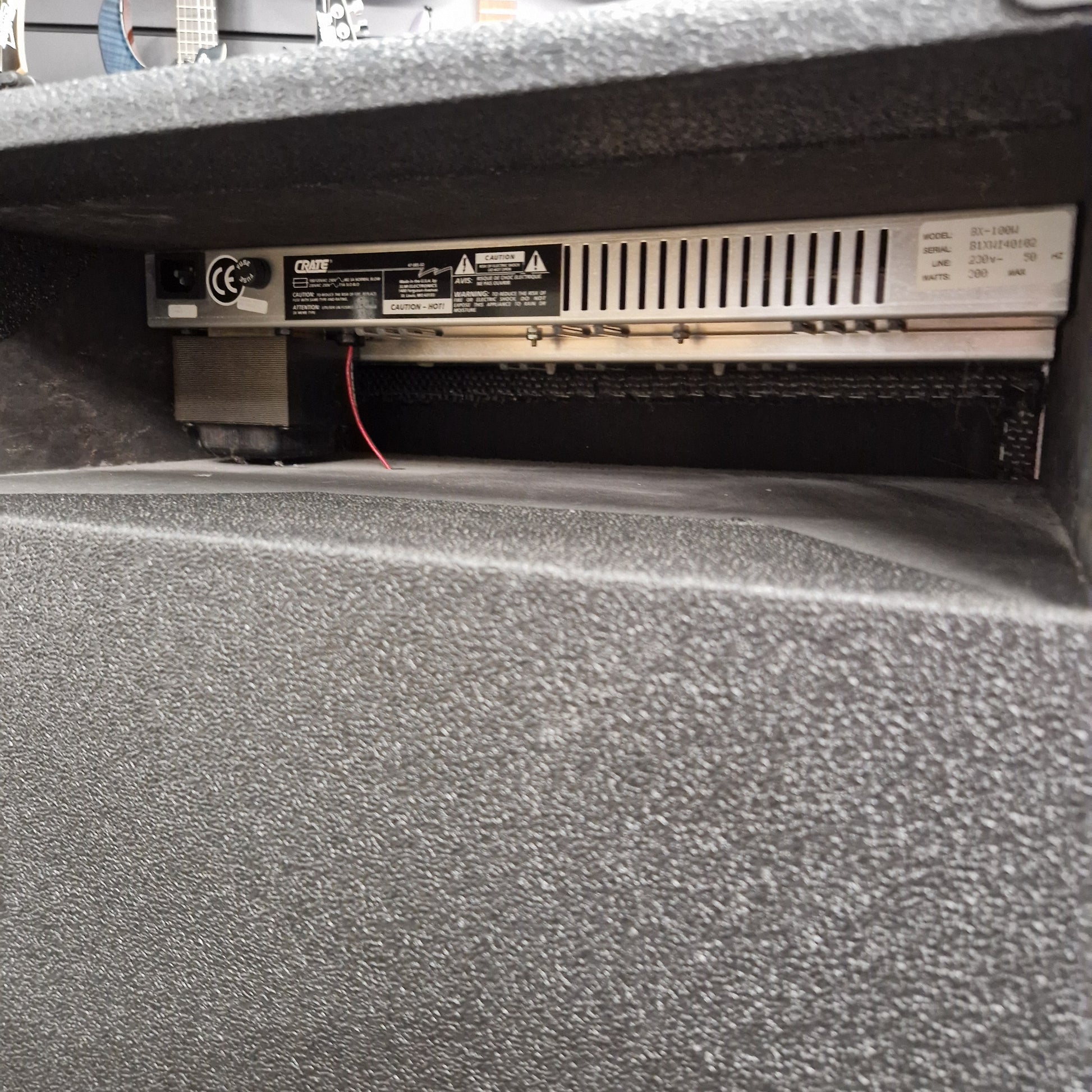 Pre-Owned Crate BX-100 Close-up of a car audio system inside a vehicle.