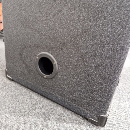 Pre-Owned Crate BX-100 Close-up of a gray textured surface with a circular hole.