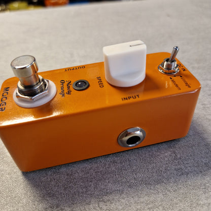 Pre-Owned Mooer MPH1 Orange guitar effects pedal with control knobs and labels on a textured surface