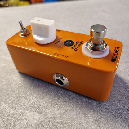 Pre-Owned Mooer MPH1 Orange guitar effects pedal with visible branding on a gray background