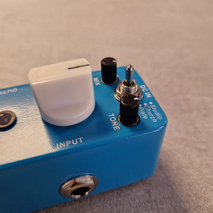 Pre-Owned Mooer MRV2 Blue audio effects pedal with switches and a control knob on a neutral background
