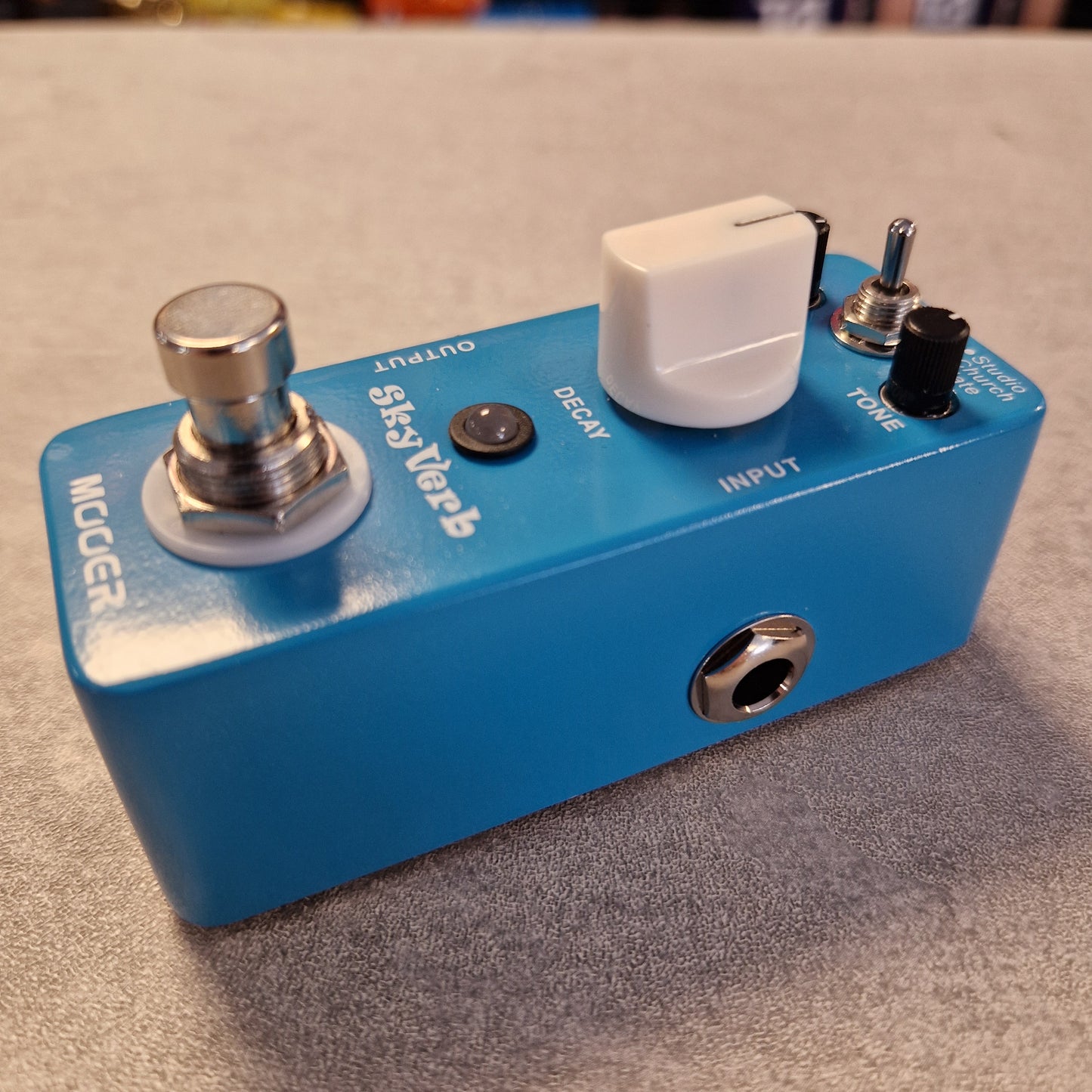 Pre-Owned Mooer MRV2 Blue guitar effects pedal with 'Moog' branding on a textured surface