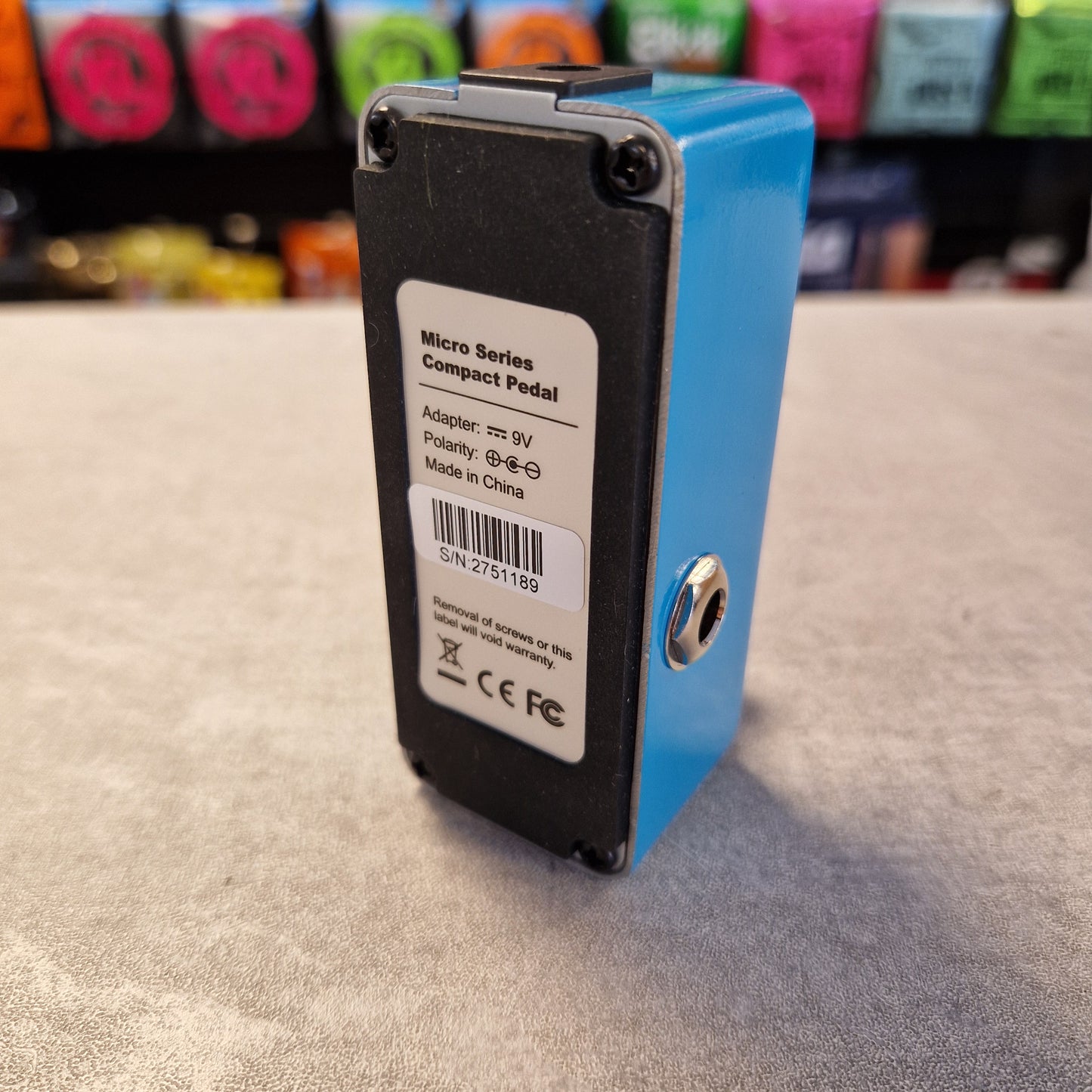 Pre-Owned Mooer MRV2 Blue and black electronic device with a label on a textured surface